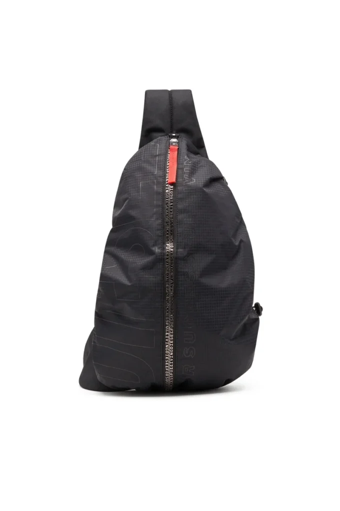 zip-d sling bag x Zip-D-Sling ryggsäck i rutig jacquardtyg zip-d sling bag x Zip-D-Sling ryggsäck i rutig jacquardtyg